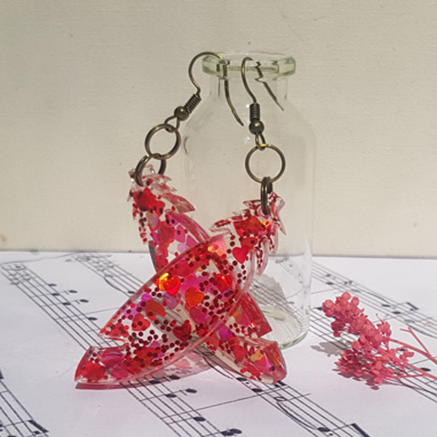 گوشواره دخترانه مدل رزینی پر 002 گوشواره دخترانه مدل رزینی پر 002