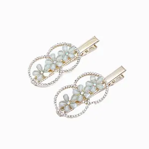 گیره مو زنانه مدل انبری نگین بابونه بسته 2 عددی