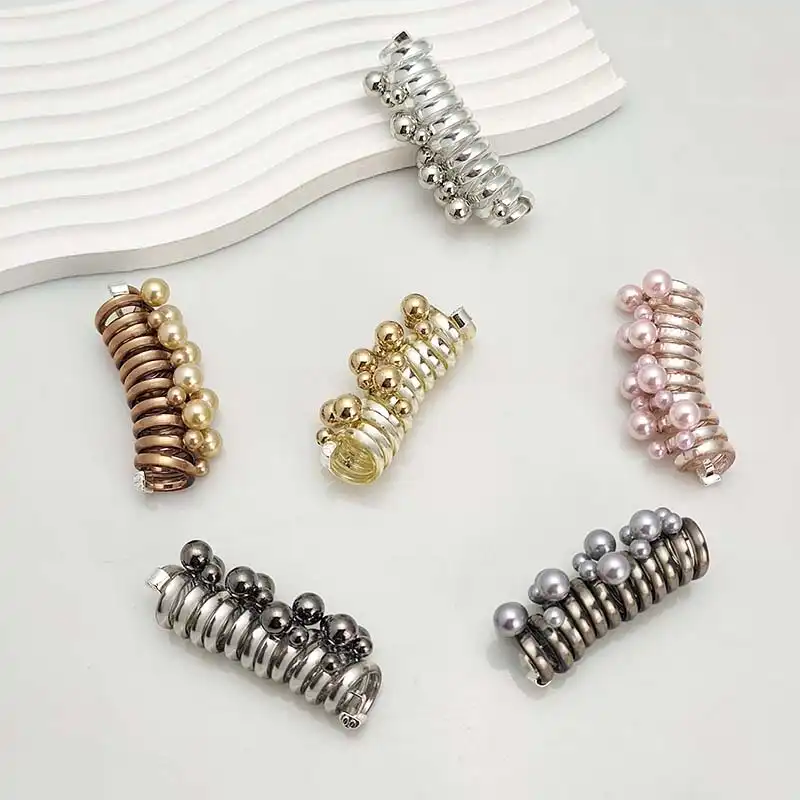 کش مو زنانه مدل فنری طرح دانه های برفی