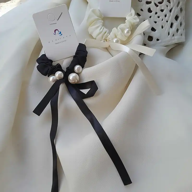 کش مو زنانه مدل اسکرانچی مروارید پانچی طرح پاپیون آویزدار کدngr327