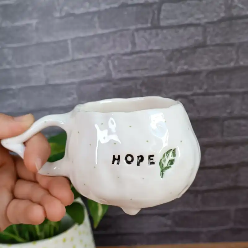 ماگ سرامیکی طرح دفرمه مدل HOPE