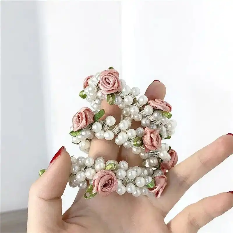 کش مو زنانه مدل مرواریدی گل دار