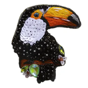 گل سینه زنانه مدل توکان