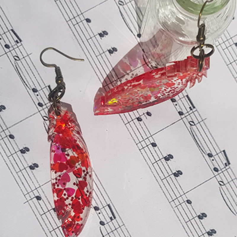 گوشواره دخترانه مدل رزینی پر 002 گوشواره دخترانه مدل رزینی پر 002