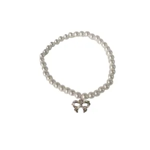 دستبند زنانه آی ام مدل مروارید و پاپیون