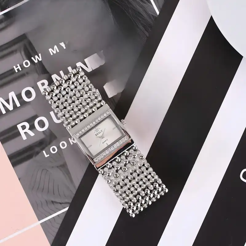 ساعت مچی عقربه ای زنانه ریِلی مدل دستبندی بند پهن نگین دار کد 2