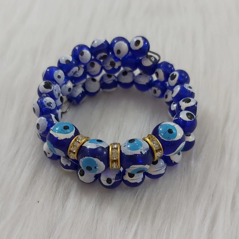 دستبند دخترانه مدل فنری مروارید چشم زخم کد chzkh111