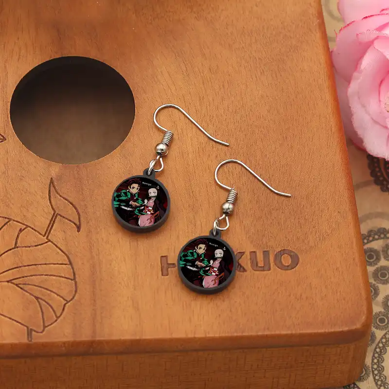 گوشواره زنانه ناکسیگو مدل شب تاب طرح شیطان کش کد ES8435