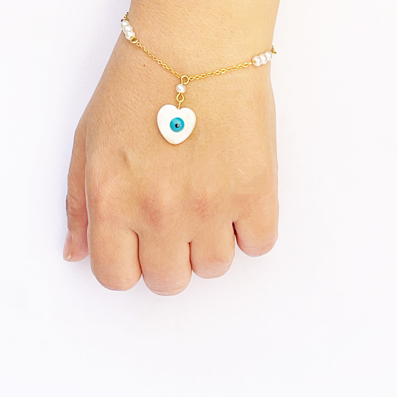 نیم ست زنانه مدل صدف و مروارید طرح چشم زخم