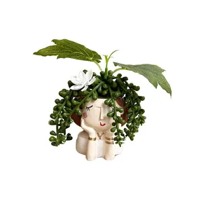 گلدان به همراه گل مصنوعی مدل عروس غوره ای 