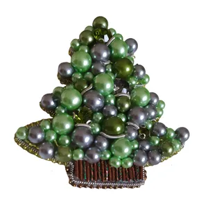 گل سینه زنانه مدل کاج