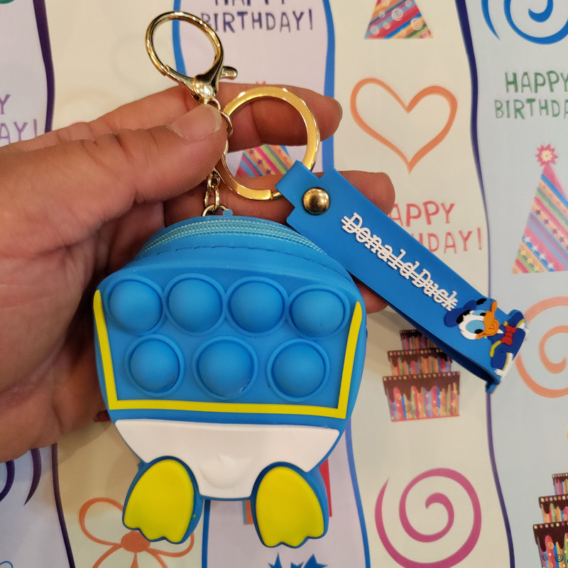 جاکلیدی دخترانه مدل سیلیکونی کیف پاپیت دار طرح اردک جاکلیدی دخترانه مدل سیلیکونی کیف پاپیت دار طرح اردک