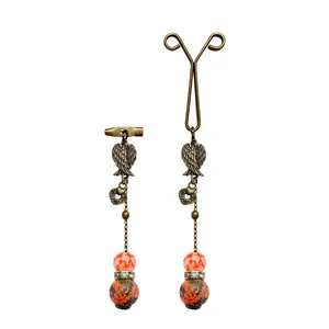 ست گیره روسری و سنجاق سینه زنانه مدل بال رنگ نارنجی