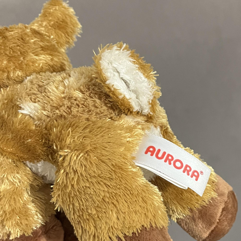 عروسک آرورا طرح آهو مدل Aurora Flopsies Fawne the Laying Deer کد SZ12/979 طول 21 سانتی‌متر