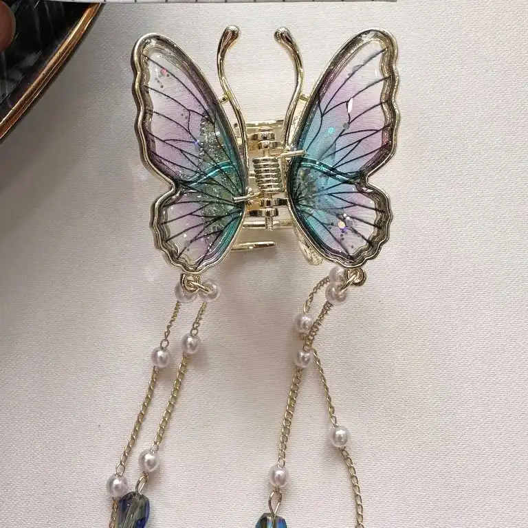 کلیپس مو زنانه مدل پروانه ای آویز دار رویه کریستالی کد 102001528