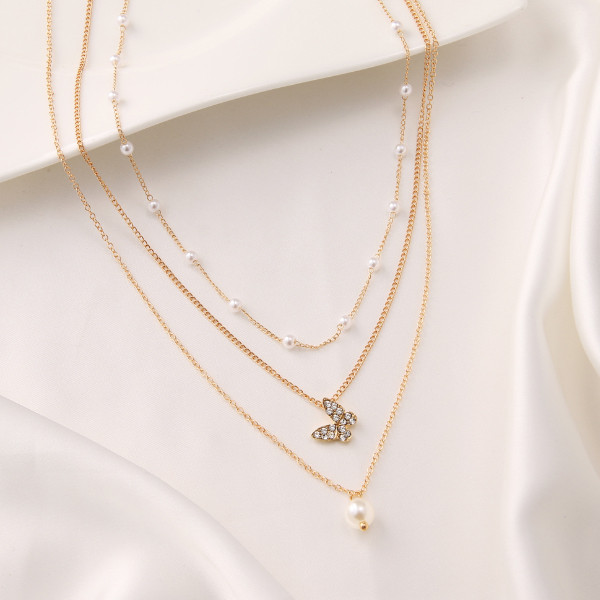 گردنبند دخترانه مدل مروارید و پروانه مجموعه سه عددی گردنبند دخترانه مدل مروارید و پروانه مجموعه سه عددی