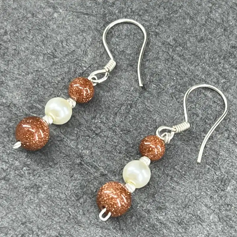 گوشواره نقره زنانه گیرا مدل G679 طرح دلربا