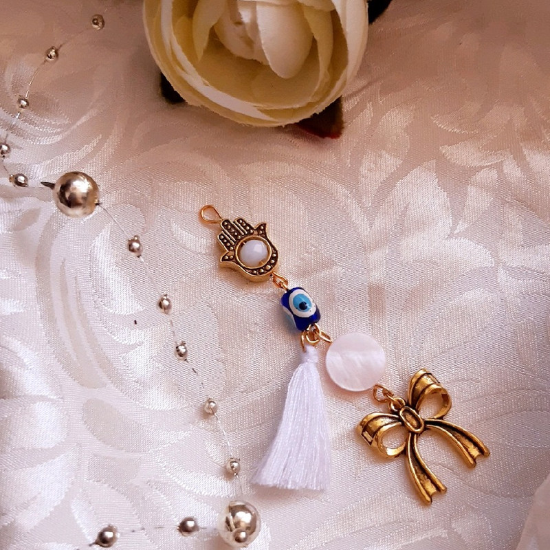 گل سینه دخترانه مدل چشم نظر کد 1557 گل سینه دخترانه مدل چشم نظر کد 1557