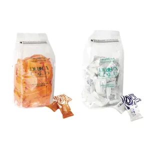  خرما شکلاتی پرتقالی و سفید با مغز بادام دلوکا - ۵۰۰ گرم بسته 2 عددی