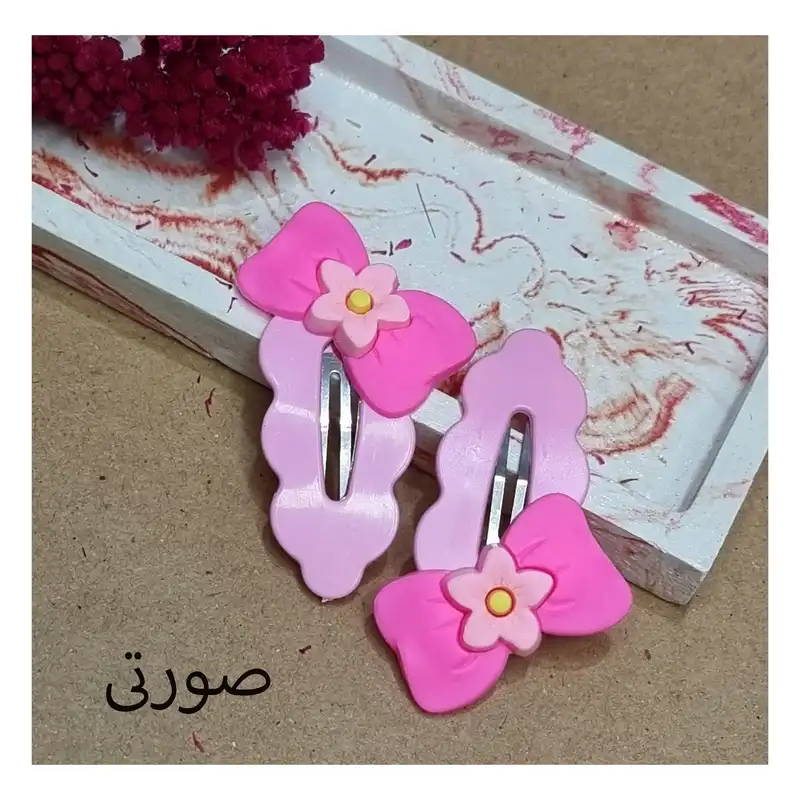 گیره مو زنانه مدل تق تقی پیکسل دار کد03 بسته 2 عددی