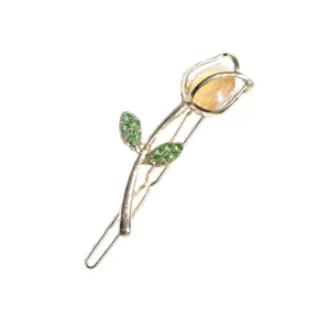 گیره مو زنانه مدل نگین دار طرح گل لاله کد brg 1995