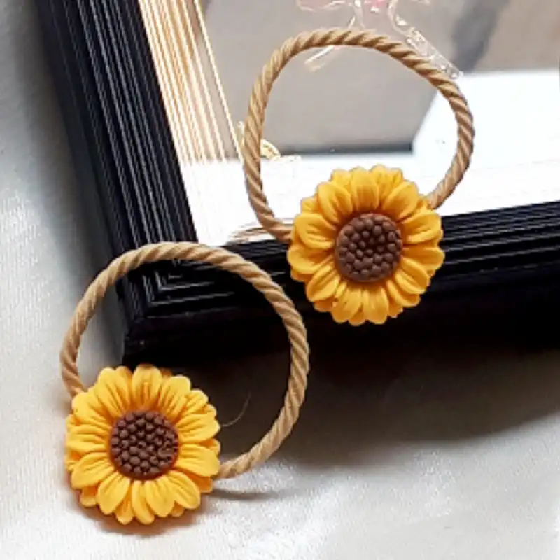 ست کش و گیره مو زنانه مدل آفتابگردان بسته 4 عددی