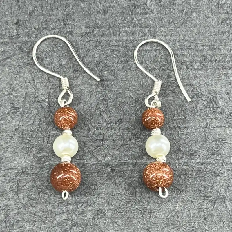 گوشواره نقره زنانه گیرا مدل G679 طرح دلربا