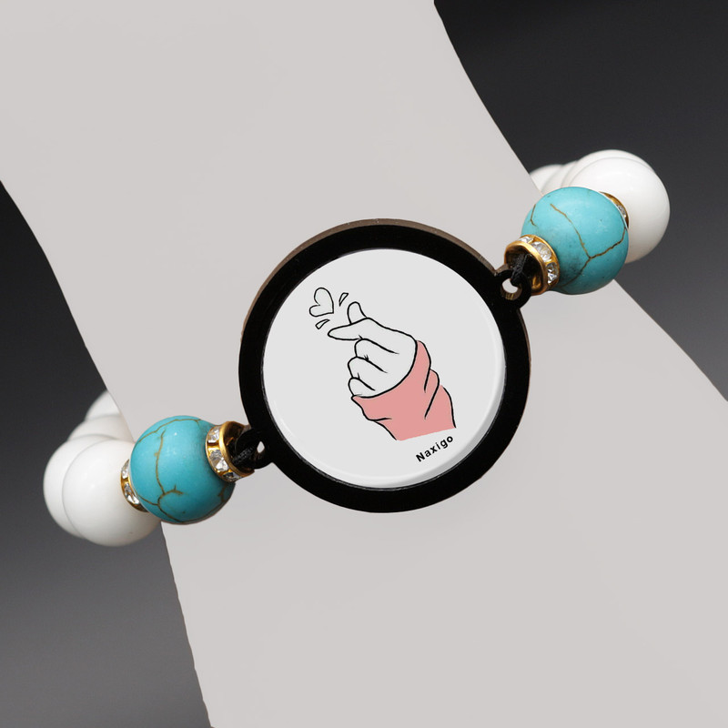 دستبند زنانه ناکسیگو طرح دست و قلب کد BR4352