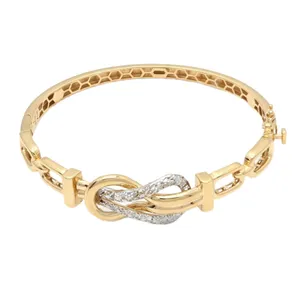 دستبند النگویی طلا کم اجرت 18 عیار زنانه طلا و شمش برلیان مدل گره عشق