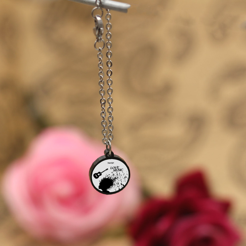 آویز ساعت زنانه ناکسیگو مدل شب تاب طرح موسیقی کد AW8828 آویز ساعت زنانه ناکسیگو مدل شب تاب طرح موسیقی کد AW8828