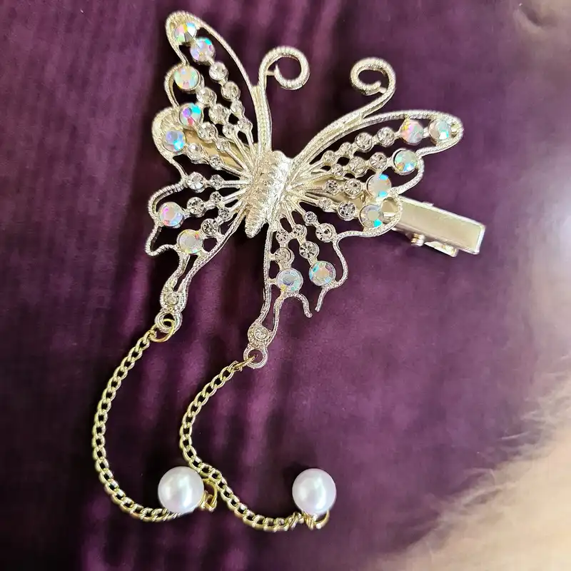 گیره مو زنانه مدل پروانه نگین‌دار مجلسی آویزدار کد brg 879