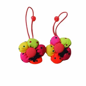 کش مو دخترانه مدل گل توپولی خالدار بسته 2 عددی