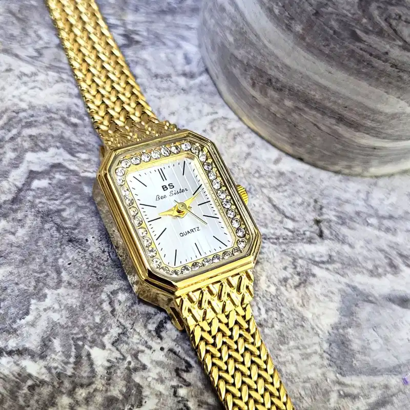 ساعت مچی عقربه ای زنانه مدل حصیری دورنگین خطی 02