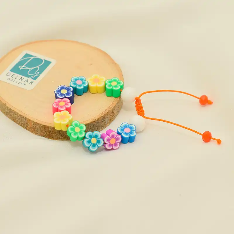 دستبند دخترانه دلنار گالری مدل گل فیمویی