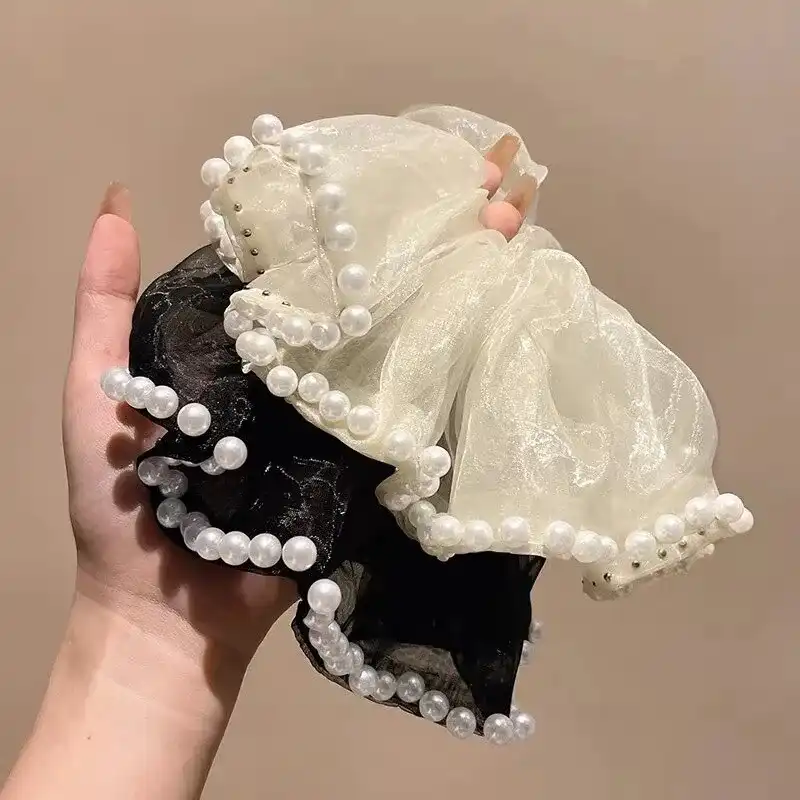 کش مو زنانه مدل پارچه ای ژورژت طرح مروارید دار بزرگ