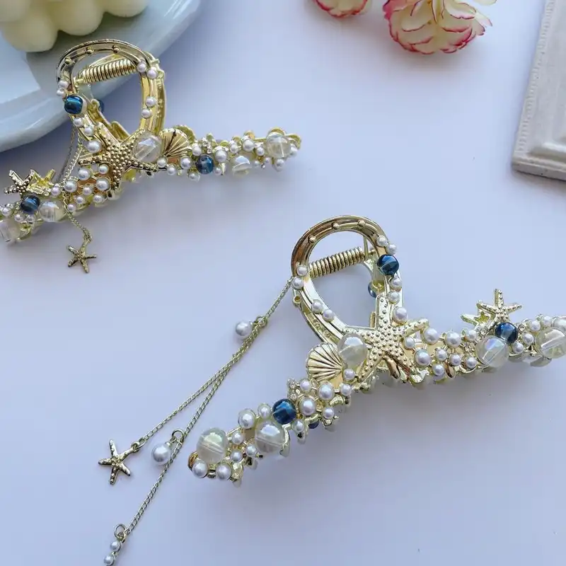 کلیپس مو زنانه مدل فلزی صدف آویزدار