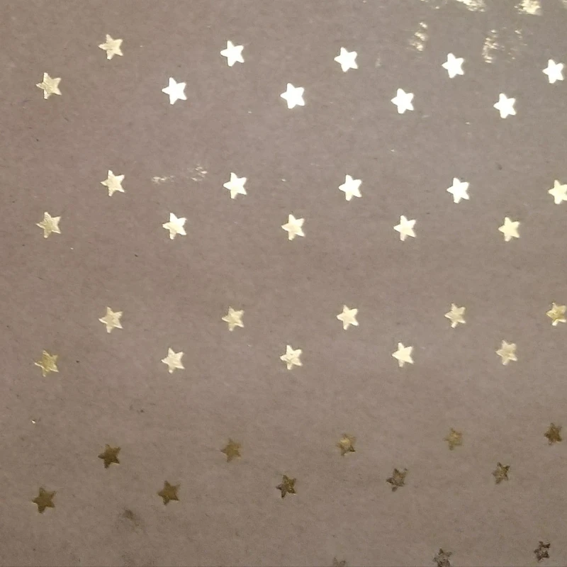 کاغذ کادو مدل کرافت طلاکوب طرح ستاره ها ی زرین سایز 70 ×50 سانتی متر بسته 3 عددی