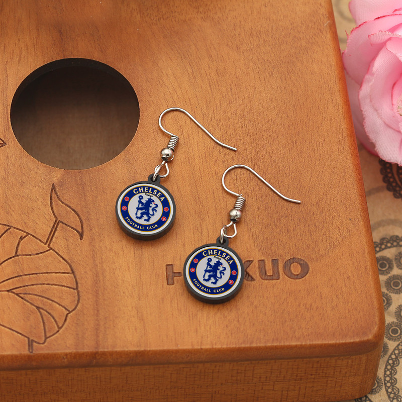 گوشواره زنانه ناکسیگو مدل شب تاب طرح چلسی کد ES7312 گوشواره زنانه ناکسیگو مدل شب تاب طرح چلسی کد ES7312