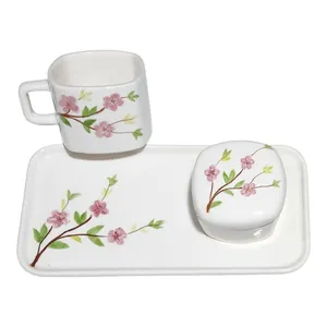 ست فنجان و قندان سرامیکی طرح شکوفه به همراه زیر لیوانی