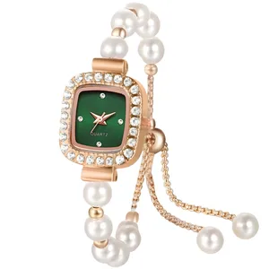 ساعت مچی عقربه‌ای کوارتز زنانه مدل مینیمال لوکس بند دستبندی مرواریدی قفل کرواتی کد ۷