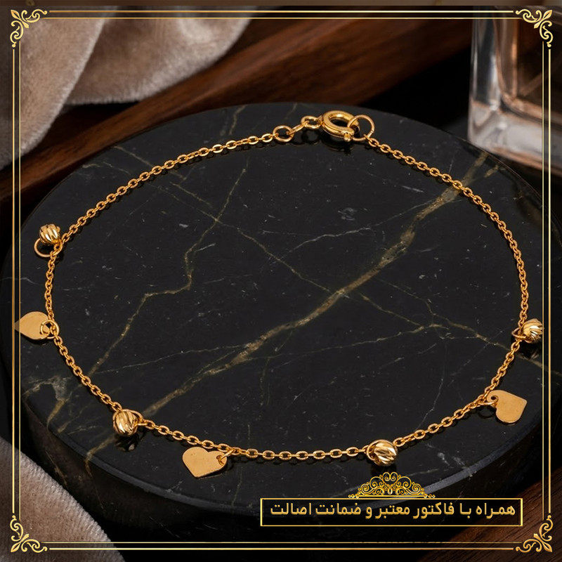 دستبند زنجیری طلا 18 عیار زنانه طلای معتمدی مدل قلب و گوی