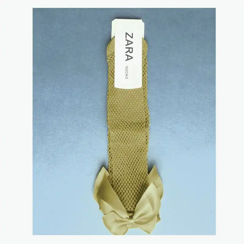 جوراب ساق بلند دخترانه مدل زنبوری پاپیون دار رنگ کرم