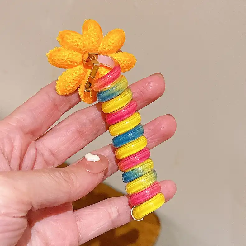 کش مو زنانه مدل فنری طرح گل آفتابگردان