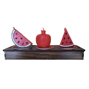 شمع طرح انار و هندونه مجموعه 3 عددی به همراه استند