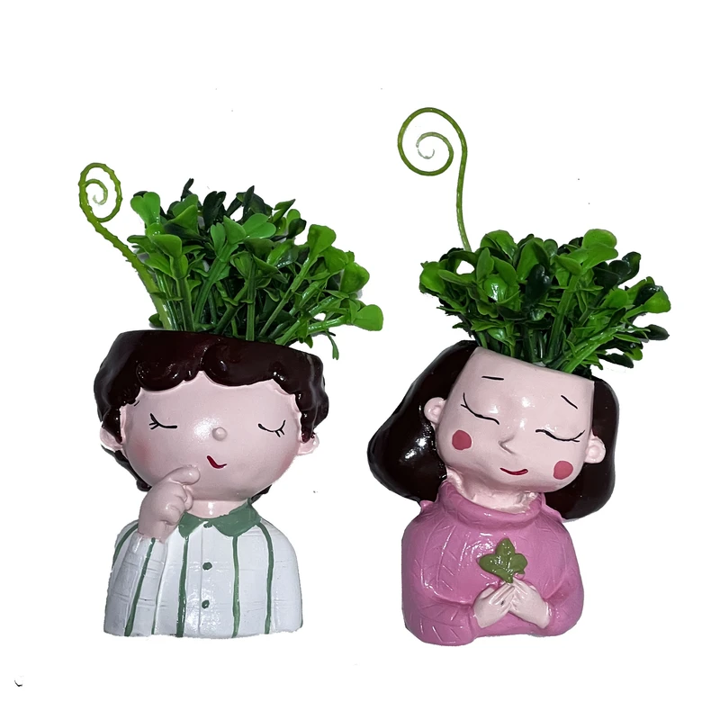 گلدان به همراه گل مصنوعی مدل دختر و پسر فرفری مجموعه 2 عددی