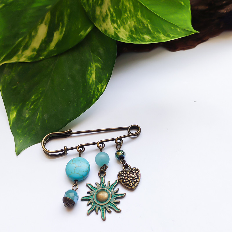 سنجاق سینه زنانه مدل خورشید سنجاق سینه زنانه مدل خورشید