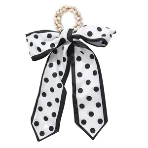 کش مو زنانه مدل مرواریدی دنباله دار ساده