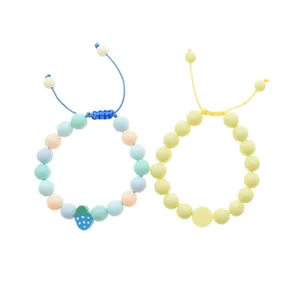 دستبند دخترانه دلنار گالری مدل توت فرنگی و لیمو بسته 2 عددی