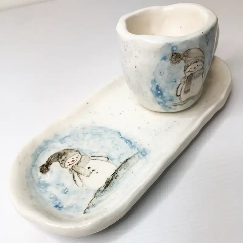 ست فنجان و زیر لیوانی سرامیکی طرح آدم برفی