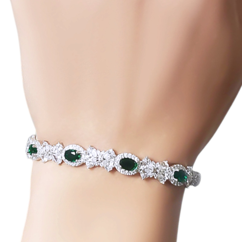 دستبند نقره زنانه گالری رضازاده مدل پاپیون فلاور زمرد 0268